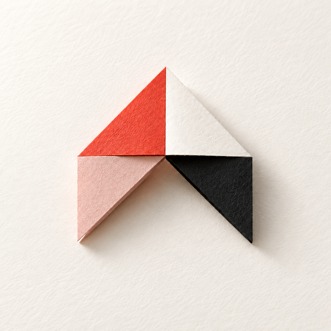 Cartesian's folded paper mark in coral, ivory, blush and charcoal